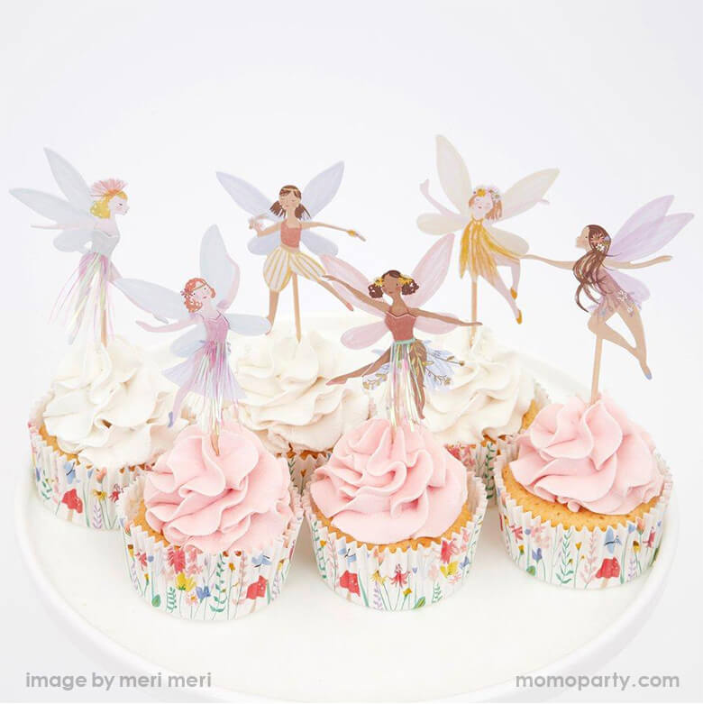 Pink and white cupcakes with Meri Meri Fairy Cupcake Kit. With beautifully illustrated fairy toppers, and lots of gold foil detail, and coordinating cupcake cases, This cupcake kit is simply darling for your little fairy. It's perfect for a spring celebration! Garden themed party, tea party, mother's day