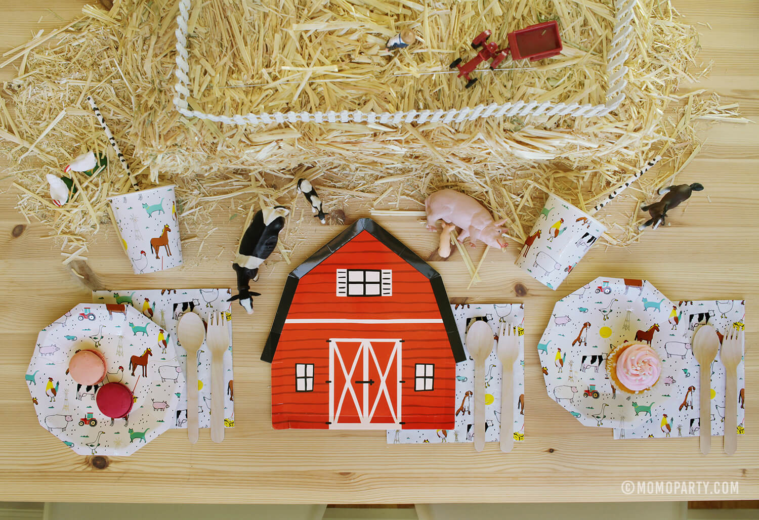 Kids party Table set up for Barn yard, Farm Animals Birthday Party with  barn house party paper plate, farm animals party plates, cups, and napkins, and Straw Bale with animals and Farmer toys