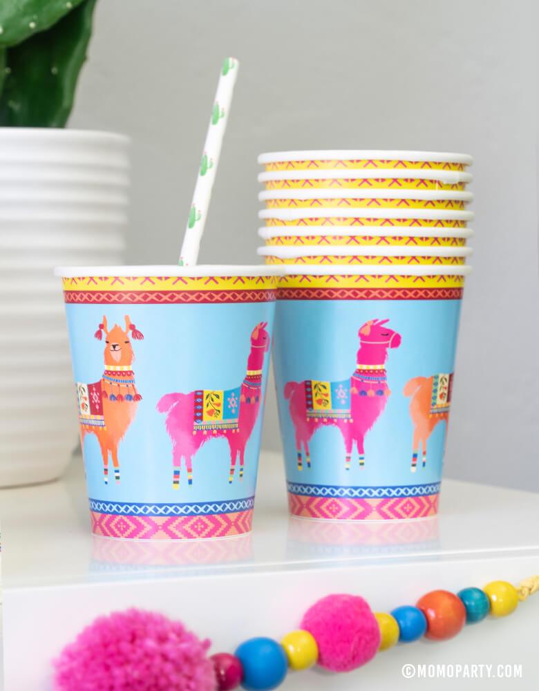Close up look of Talking Tables Boho Fiesta Llama Cups with Cactus printed paper straws, and Boho Fiesta Pom Pom Garland for A Boho Fiesta Themed Party, or Modern Cinco De Mayo Party
