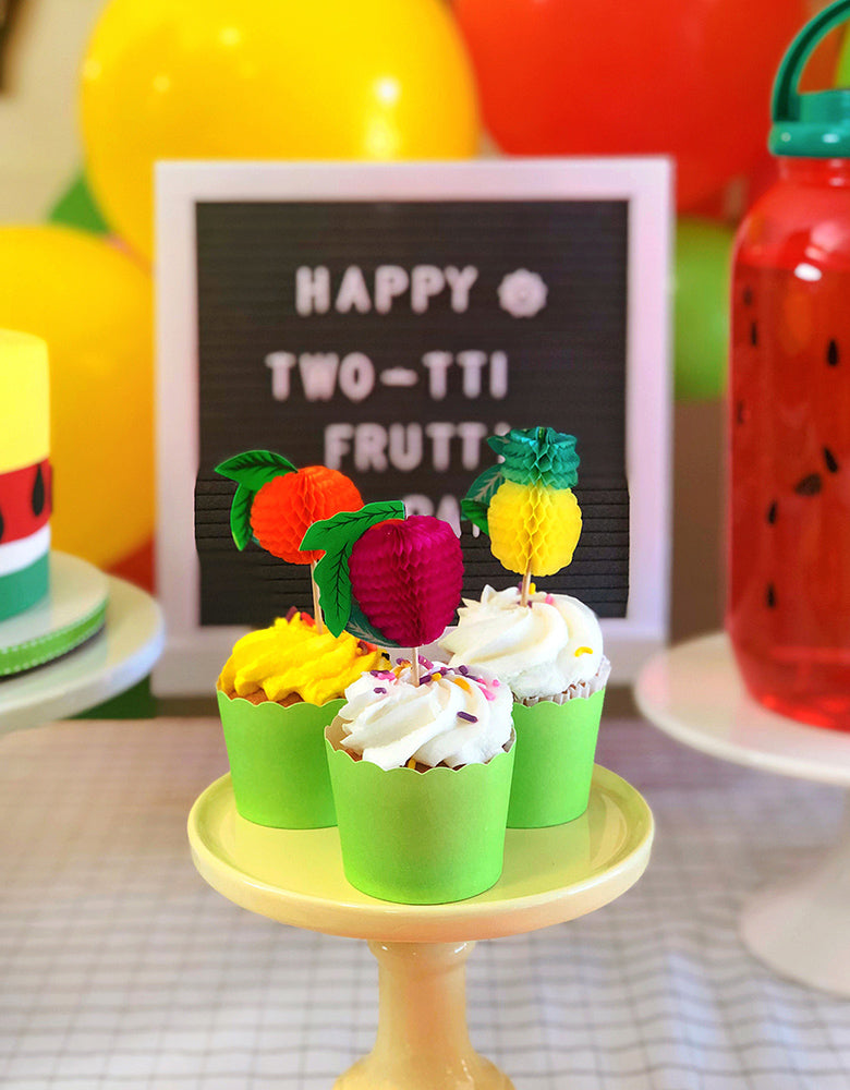 Colorful Honeycomb Fruit Picks on cupcakes for fruit party