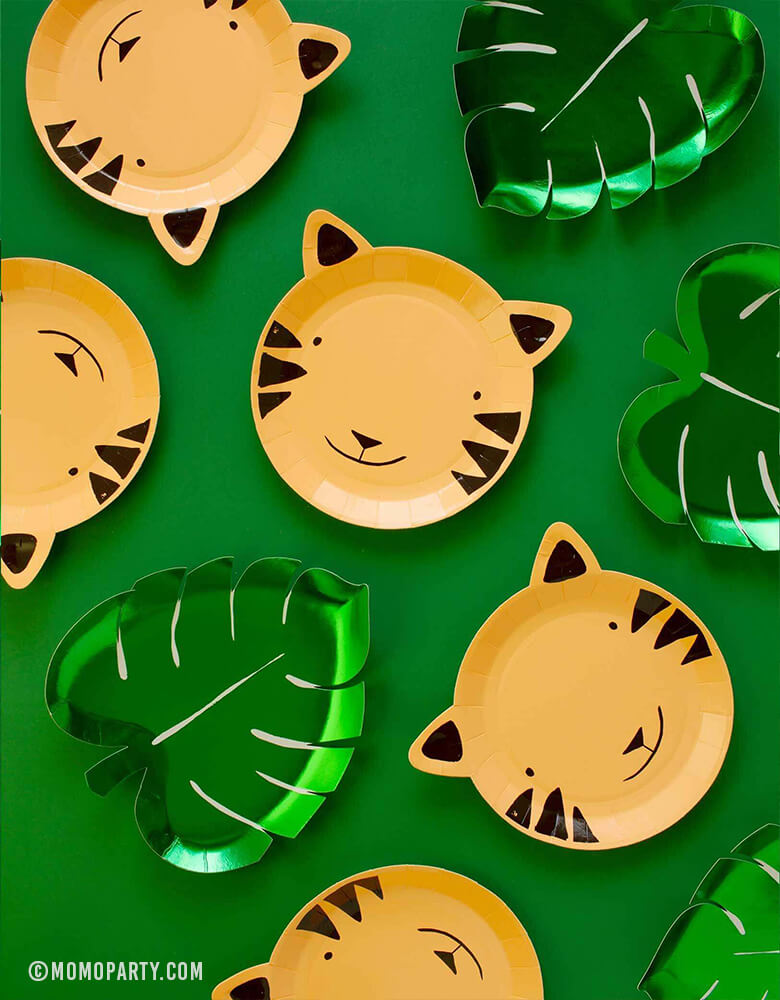 Meri Meri Party ware of Green Palm Leaf shaped Foil Paper Plates with Tiger shaped paper plates on green backgound, Party in a box of tiger paper plate for kids safari theme fun birthday ideas, great party ideas for 1 year birthday