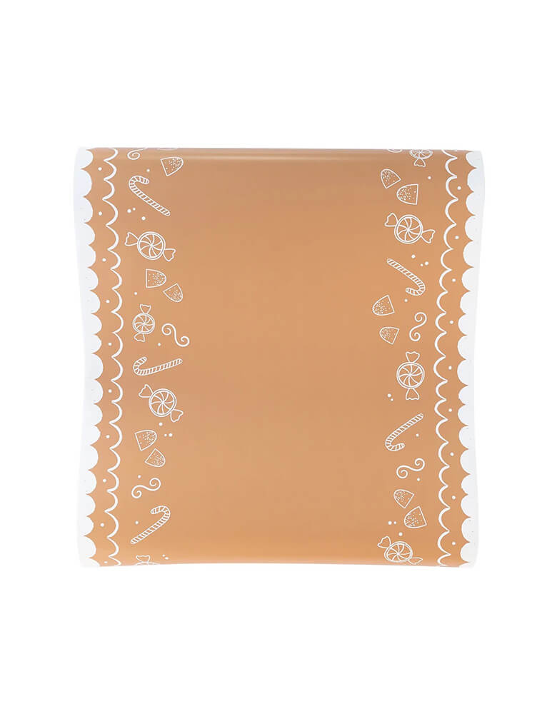 Momo Party's 16" x 120" Gingerbread Table Runner by My Mind's Eye. Featuring white frosted candy icons that look good enough to eat, this table runner is the perfect addition to any Holiday table that needs a touch of whimsy. 