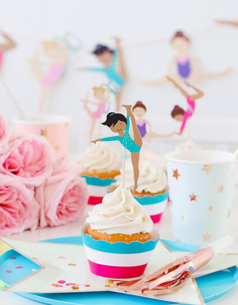 Cupcakes with Gymnastics Themed toppers and star designed tableware for a girl Gymnastics Party styled by Twinkle Twinkle Little Party