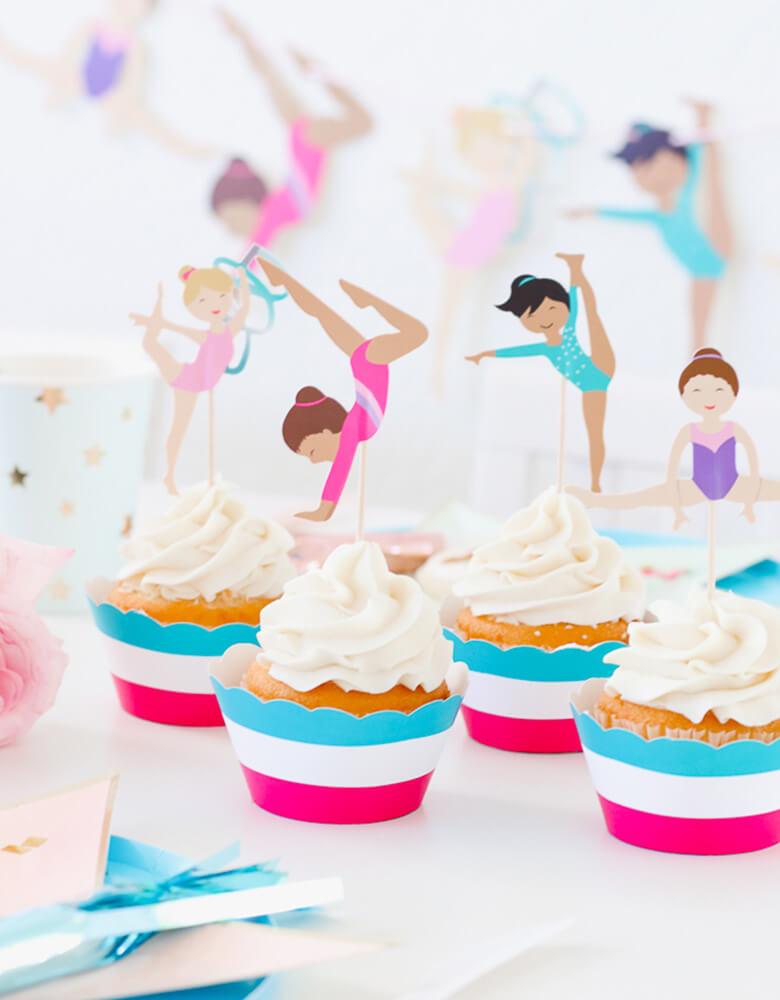 Cupcakes with Gymnastics Themed toppers on a party table from a girl Gymnastics Party styled by Twinkle Twinkle Little Party