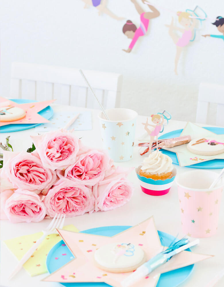 Cupcakes with Gymnastics Themed toppers and star designed tableware for a girl Gymnastics Party styled by Twinkle Twinkle Little Party