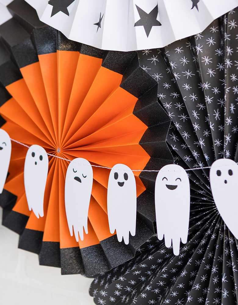 My Mind's Eye Boo To You Ghost Banner hung with a set of halloween themed paper fans in black, orange and white