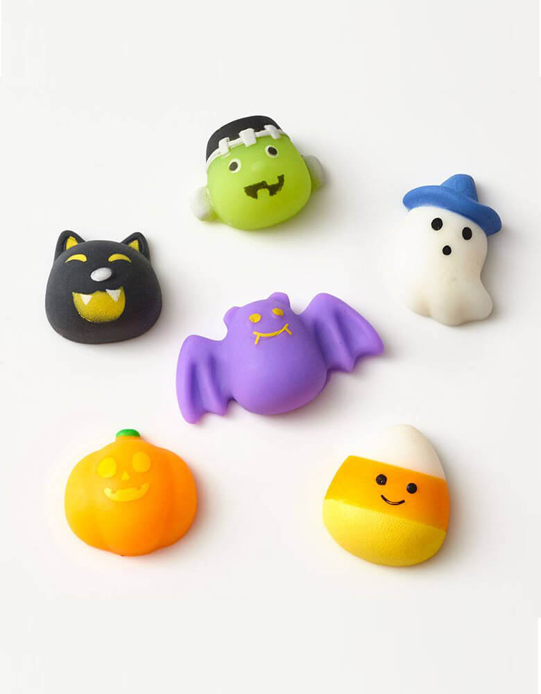 Paper Source Halloween Squish Toys featuring a black cat, a candy corn, a pumpkin, a bat, a ghost and a Frankenstein , perfect for a Halloween party favor for kids.