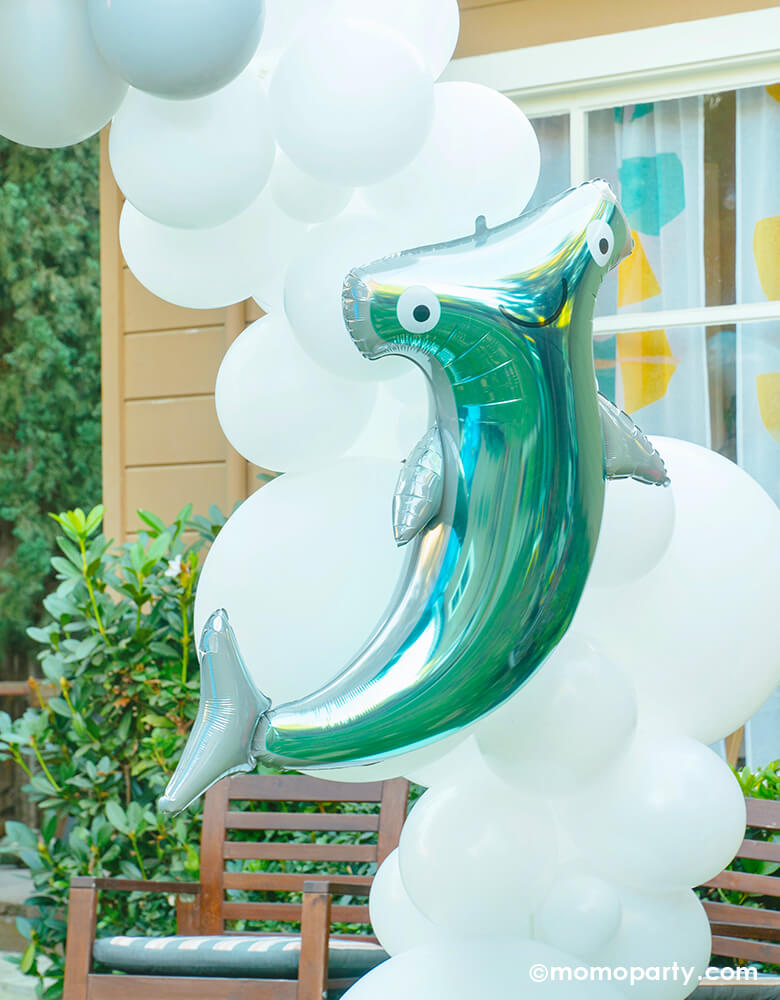 Under the sea yard party of Anagram 41" Hammerhead Shark Foil Balloon over the white blue tone of balloon garland arch. Party planning, partywares and Photo by Party Boutique Online at momoparty.com