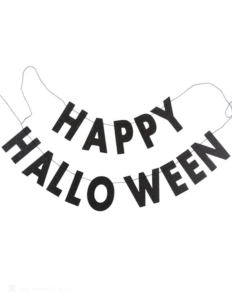My Minds Eye - Happy Halloween Black Glitter Banner. Set includes 2 separate banners: HAPPY & HALLOWEEN text with with Black Glitter details.  HAPPY is about 1 foot long, HALLOWEEN is about 2 feet long . Decorate your goodie table, or hang with our vintage inspired Halloween fans to create a truly spooky backdrop. 
