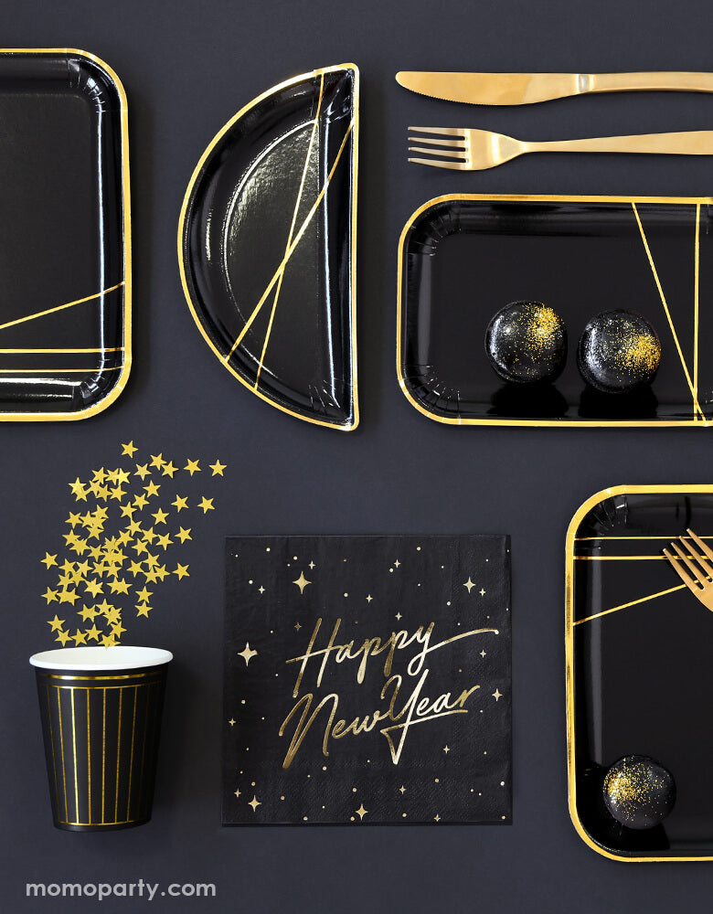 Black and gold new year party table set up with dedicated layout with Party Deco - Happy New Year Large Napkins, black and gold foil special shaped party plates with gold foil truffle chocolate on it, black paper cup with gold stripe print with gold stars confetti  in a black table top. Ring in the New Year in style with this gorgeous Happy New Year party collection with gold foil detail. This black and gold new year collection is the perfect party tableware for a new year party! 