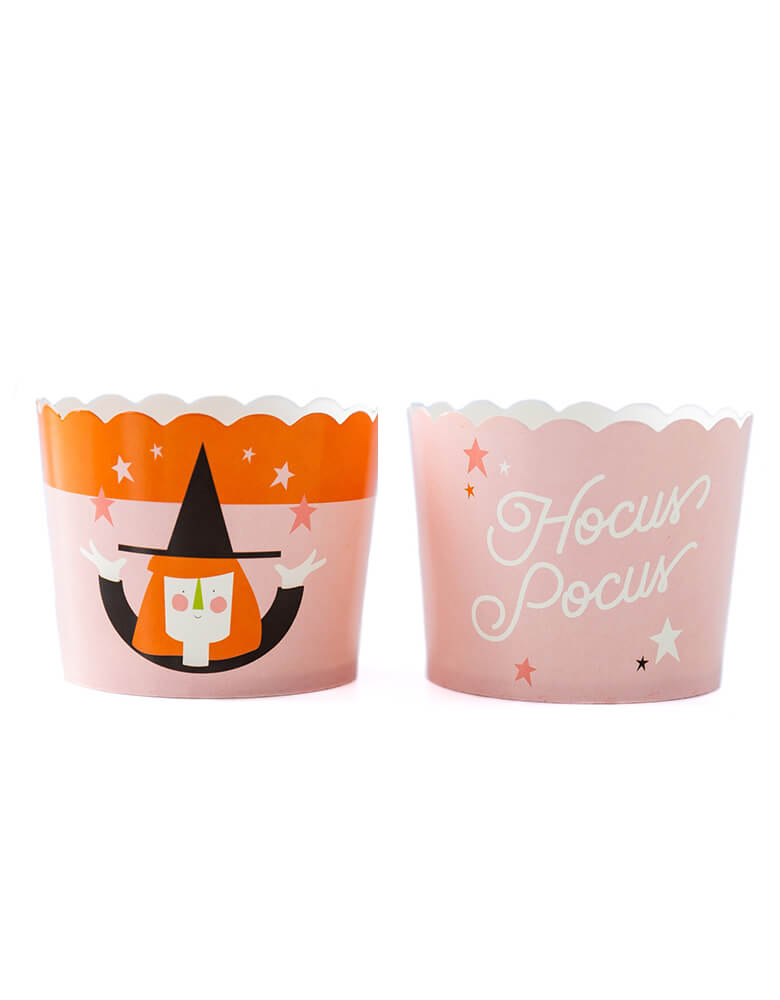 My Minds Eye PLCC732 - HOCUS POCUS WITCH BAKING/TREAT CUPS. Pack of 50 in 2 designs, one with cute witch illustration in a pastel pink and orange color tone, another food cups with "Hocus Pocus" text  with stars in a pastel pink cup. These fun baking cups are perfect for baking Halloween cupcakes right in the oven