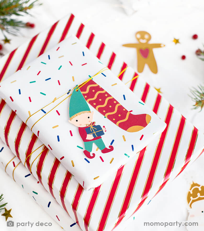 Christmas party gift with red gold stripe wrapping paper and confetti pattern wrapping paper with Party Deco - Santa & Elf Gift Tags. including Santa, Elf, stocking and gingerbread man t with gold strings. . This set of Christmas gift tags is simply adorable for this Holiday season. also hanging it on your christmas tree as ornaments