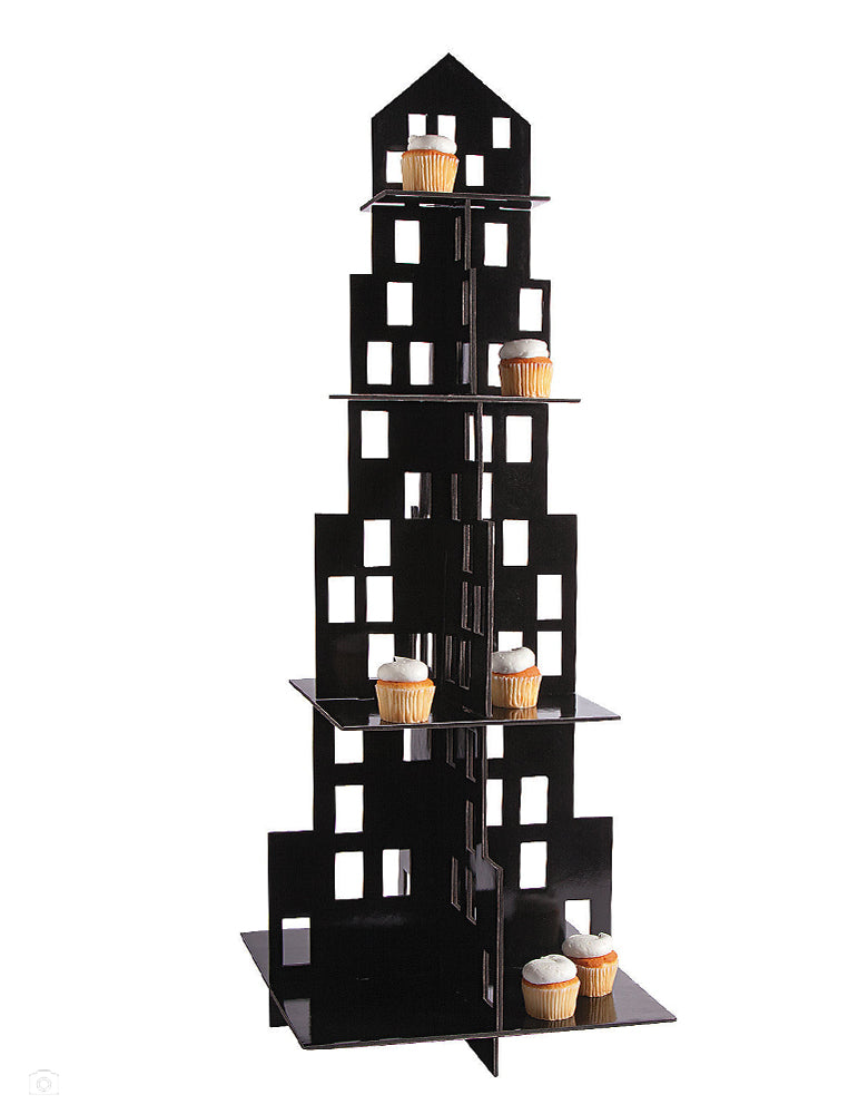 Large City Skyscraper Cupcake Stand by fun express. Complete your party’s skyline with a cupcake stand or appetizer display that’s sure to stand out. With 4 tiers, this large cupcake holder has plenty of space to feature plenty of food. This black foam building features cutout windows and makes a must-have addition for your city party theme. Foam. 16" x 42" Simple assembly required. 