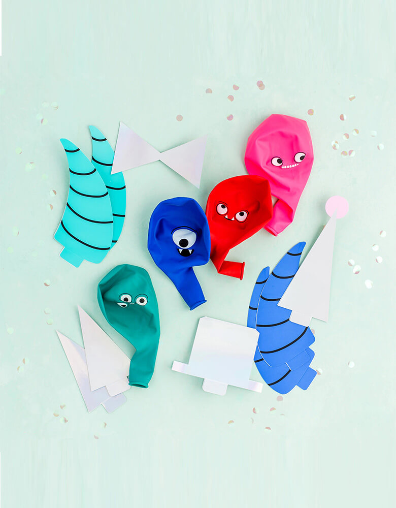 Daydream Society Little Monsters DIY balloon kit which includes Pack of 20 balloons, 4 in each color 4 pairs of horns, 24 paper spikes + accessories 36 clear glue dots and 80 feet of twine, perfect balloon decorations for a monsters themed party or Halloween bash