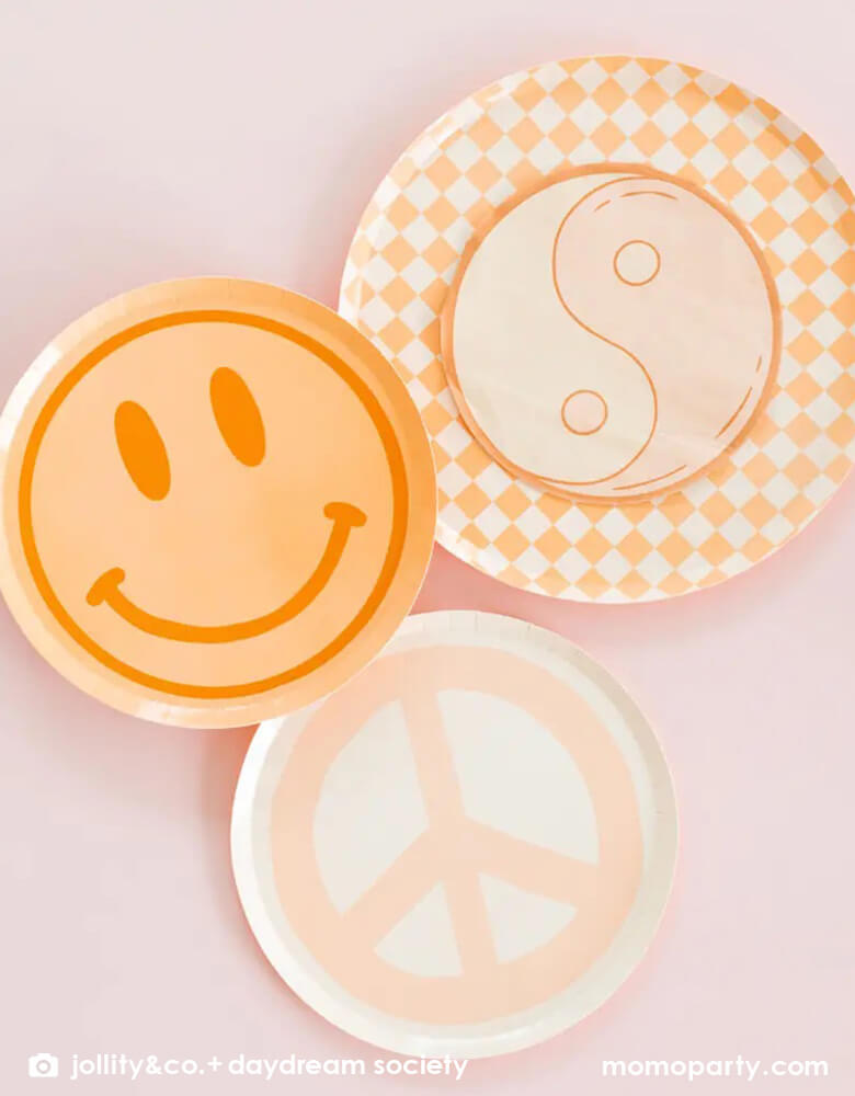 Momo Party's Love and Peach collection by Jollity & Co. featuring 8" smily face dessert plate in peach, 10" Check it! Peach and cream checker patterned dinner plates, pairing with love and peace yin yan symbol napkins and light peach dessert plate.