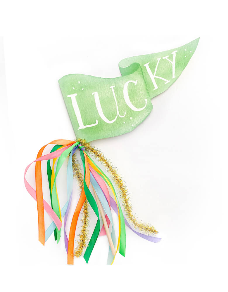 Cami Monet - Lucky St. Patrick's Day Party Pennant. This Handmade pennant made in United States of America, in Size: 10 x 5 inches. This is made of 120 lb. luxe watercolor texture paper with handwriting "Lucky" text in watercolor illustration on a green background for extra whimsy. With green orange yellow and pink, with gold stripe mixed Ribbon and sparkle garland. This adorable Lucky party pennant is a perfect for your St. Patrick's Day celebration!