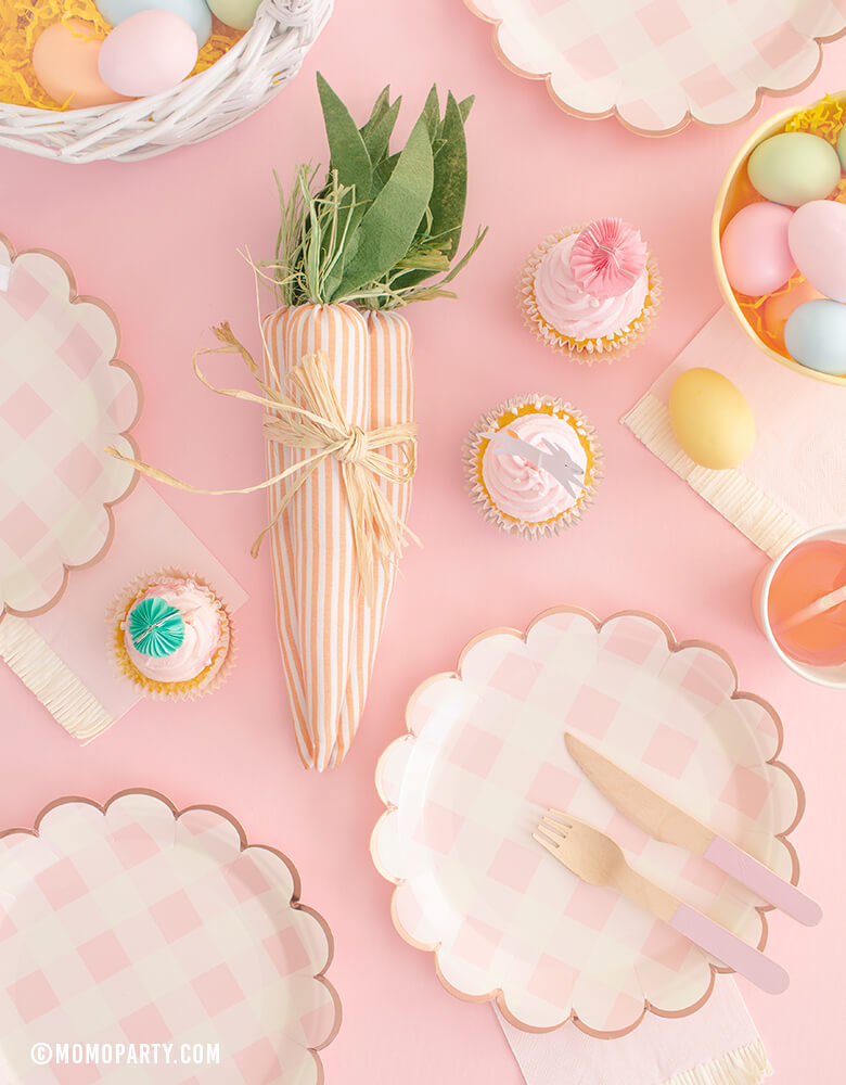 My Minds Eye Cake By Courtney Pink Buffalo 9" Scalloped Large Plates with Carrots toy in the middle and cupcakes with easter bunny cupcake topper, basket with pastel easter eggs, baby pink fringe napkins on the table for a modern easter celebration
