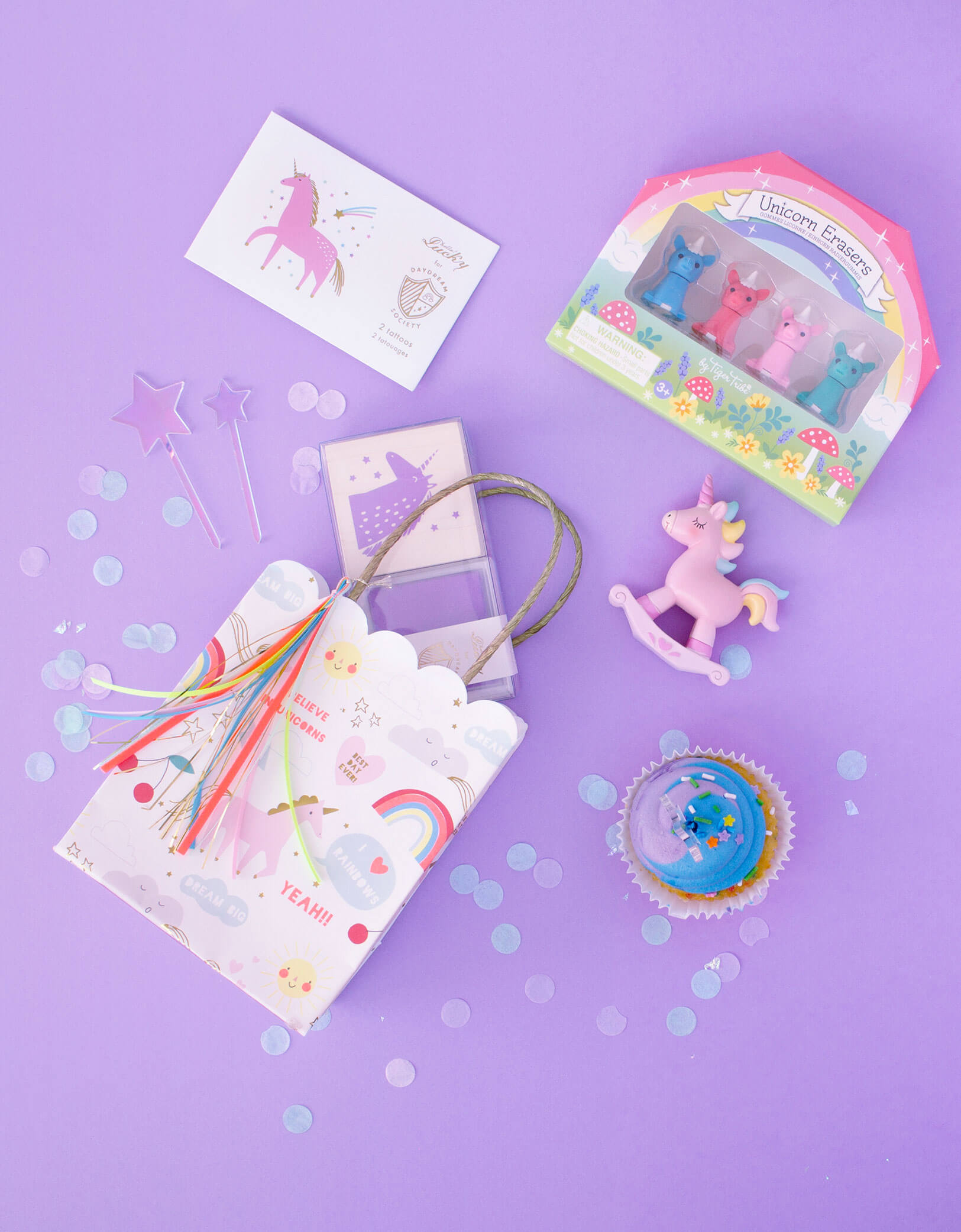 unicorn party bag with unicorn eraser, topper, stamp and tattoos