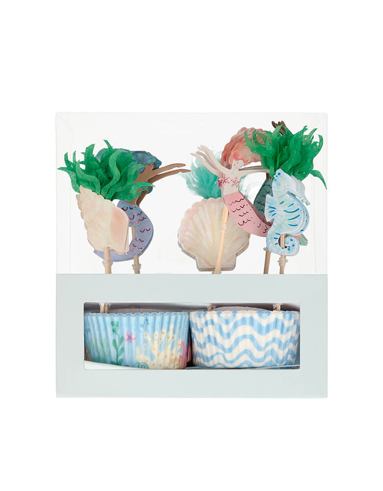 Meri Meri Mermaid Cupcake Kit. Pack of 24 cases in 2 designs, 24 toppers in 6 designs .It includes 24 toppers, with 6 designs including beautiful mermaids, a seahorse and seaweed. The 24 cupcake cases feature 2 charming coordinating designs. The kit is presented in a special box, which makes a delightful gift.