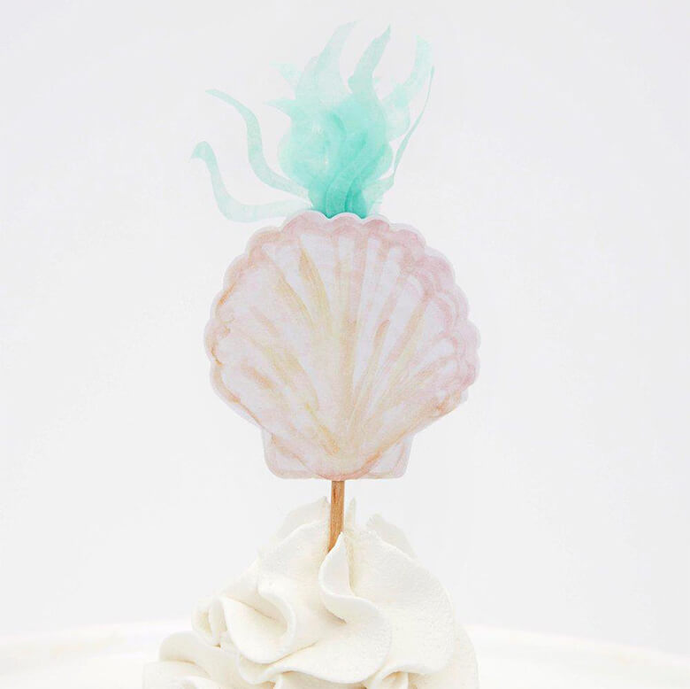 Meri Meri Mermaid Cupcake Kit topper with a watercolor illustrated pastel pink sea shell and tissue paper made seaweed design