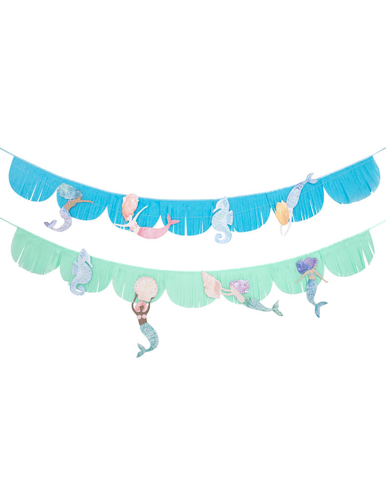 Meri Meri Mermaid Fringe Garland. 8.5 feet. This gorgeous fringed tissue paper garland, featuring beautiful mermaids and seahorses, with shimmering blue and pink foil detail. Beautifully crafted from tissue paper sewn onto satin ribbon with cotton thread, The mermaids are threaded onto metallic silver thread, Lots of shiny blue and pink foil detail for a special effect. modern and high quality partyware for a mermaid themed birthday, under-the-sea party, or a cute room decoration for mermaid lovers.