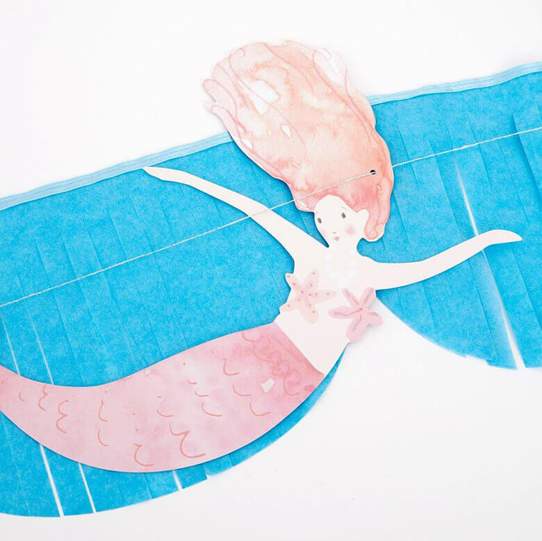 close up details of Mermaid Fringe Garland, with a watercolor mermaid design
