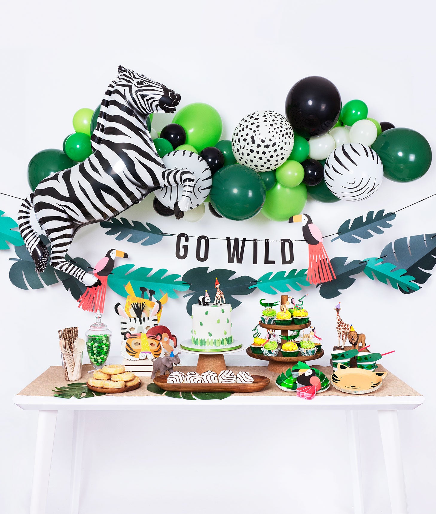 kids jungle themed birthday party inspiration table and decoration set up