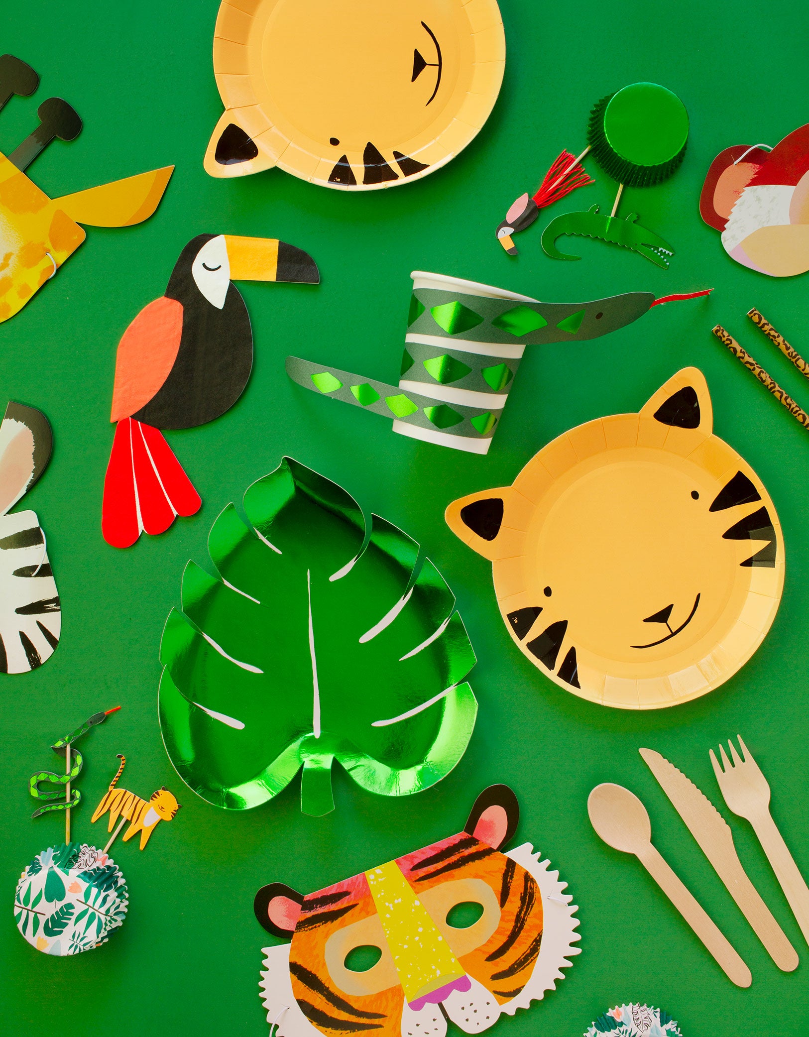 Meri Meri Party wares of Green Palm Leaf shaped Foil Paper Plate, Tiger paper plate, Toucan Napkin, Snake cup, Safari animal cupcake toper with green foil cupcake sleeve, Animal party masks for jungle party supplies all in a box, for kids safari theme fun birthday