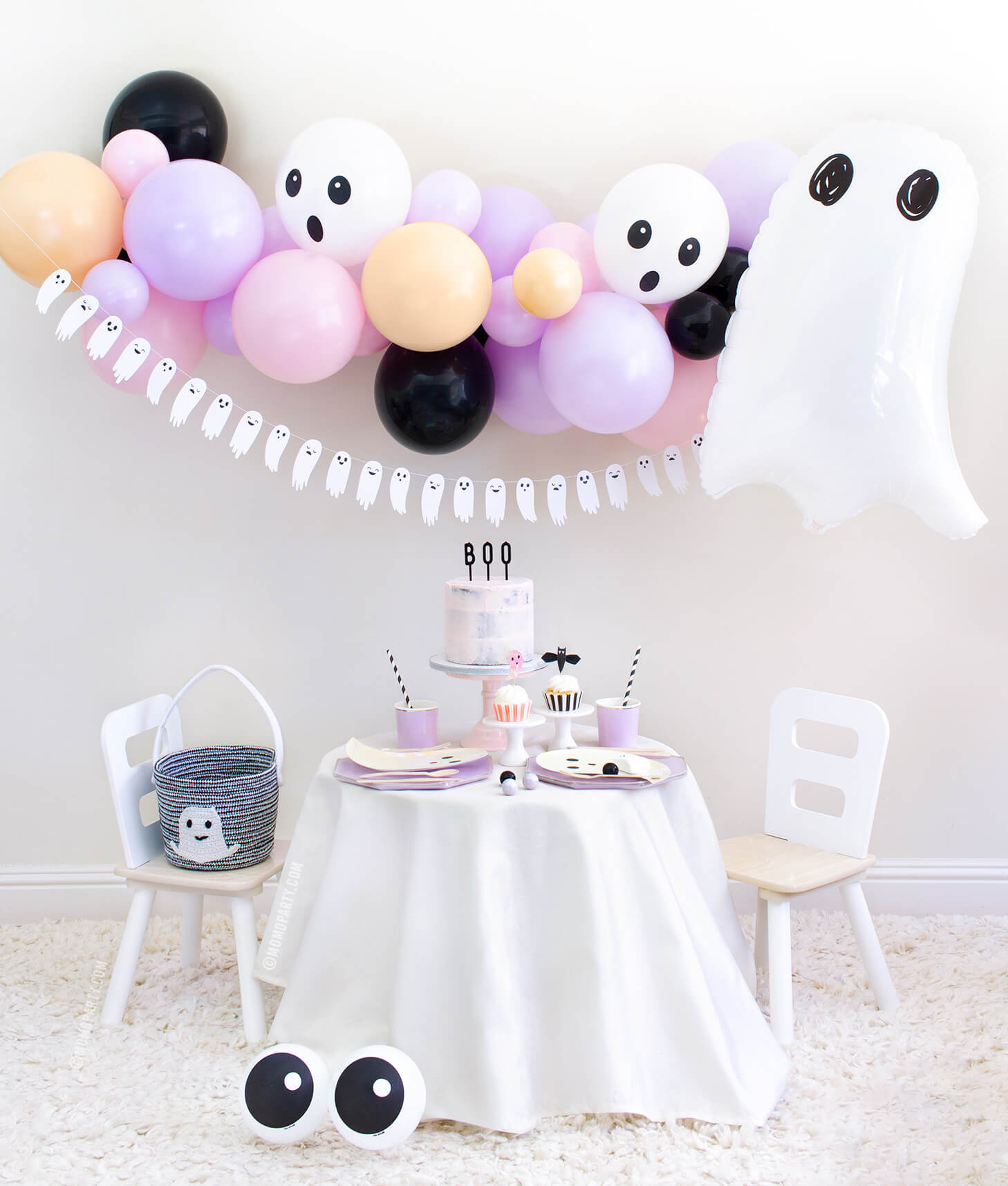 Momo Party 2020 Halloween Boo To You Party Look with: Halloween Ghost Mylar Balloon, Pastel pink and purple balloon garland, Boo To You Ghost Banner as wall decoration, Table set up with Lilac Dinner Plates and Tumbler Cups,  Iridescent Ghost Plates, Holographic Ghost Napkins, pink cake with Boo letterboard cake topper, 2 Friendly Eyeball latex Balloons as an eye, Inspire ideas for you Kids Halloween Party, Pink Halloween, Not too Spooky birthday party, Hocus Pocus party, spooktacular halloween party