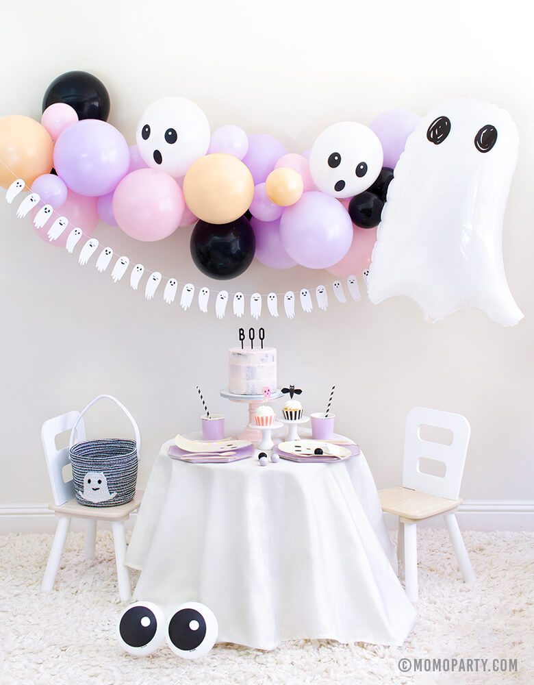 Momo Party 2020 Halloween Boo To You Party Look with: Halloween Ghost Mylar Balloon, Pastel pink and purple balloon garland, Boo To You Ghost Banner as wall decoration, Table set up with Lilac Dinner Plates and Tumbler Cups, Iridescent Ghost Plates, Holographic Ghost Napkins, pink cake with Boo letterboard cake topper, 2 Friendly Eyeball latex Balloons as an eye, Inspire ideas for you Kids Halloween Party, Pink Halloween, Not too Spooky birthday party, Hocus Pocus party, spooktacular halloween party