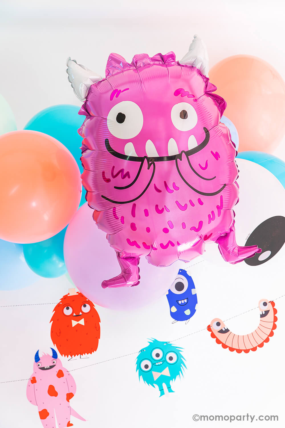 Little monster party decorated with Anagram Balloons - Purple Monster Foil Balloon with little monster themed balloon cloud with friendly eyes latex balloon and little monster garland, for a cute halloween party, little monsters themed birthday party 