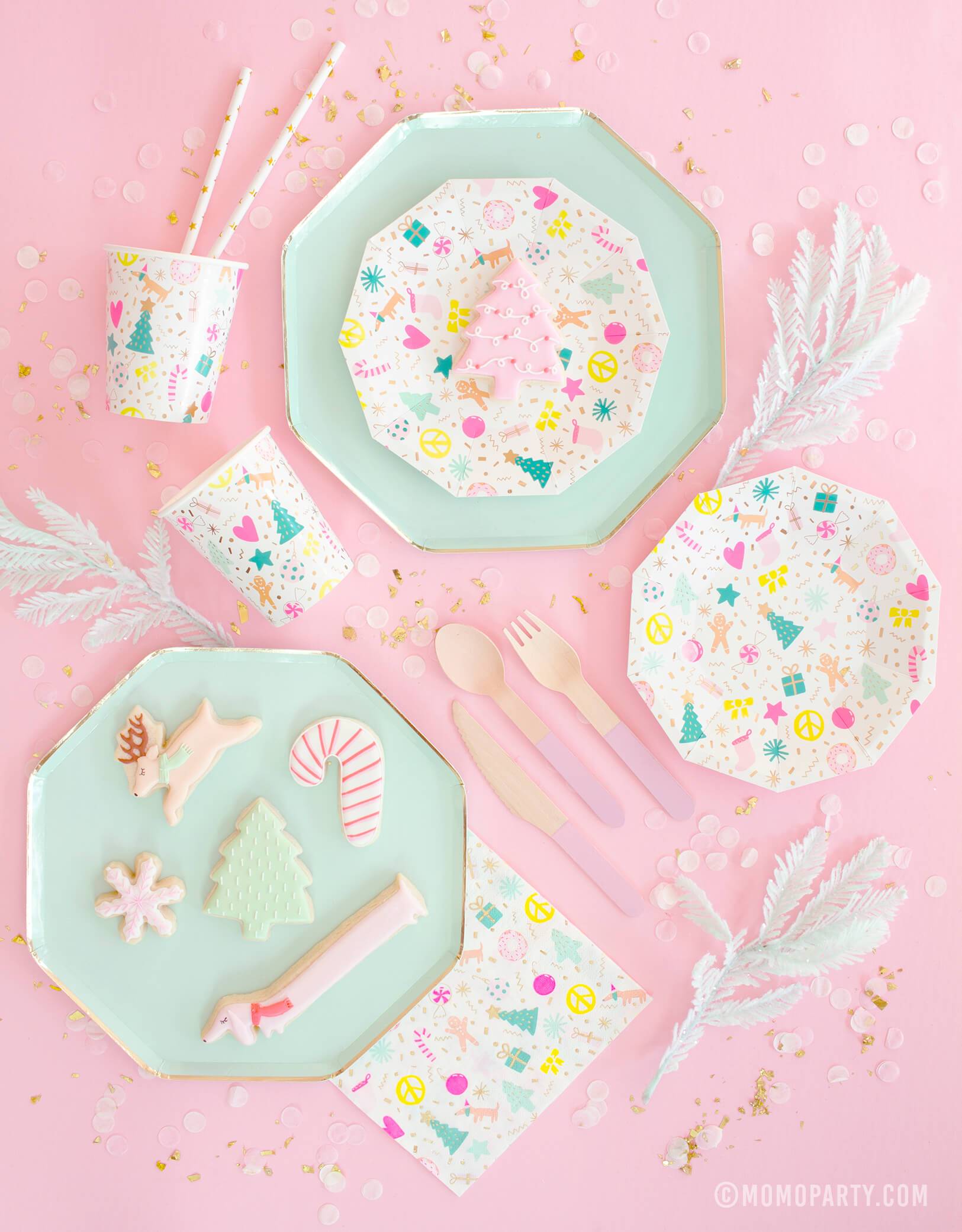 Meri Meri Mint Large Dinner Plates pair with Daydream Society Merry and Bright Holiday Christmas Party Plates,Napkins and Cups, Pink wooden utensils, Christmas themed cookies for a pastel Christmas party celebration    