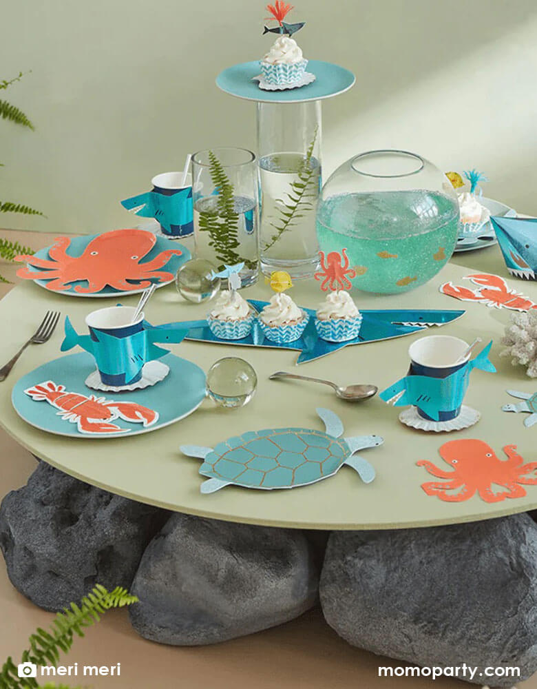 A festive party table filled with Momo Party's sea collection by Meri Meri, featuring tableware in sea creature designs including turtles, octopus, lobsters, sharks, it makes great inspiration to kid's under the sea themed parties.