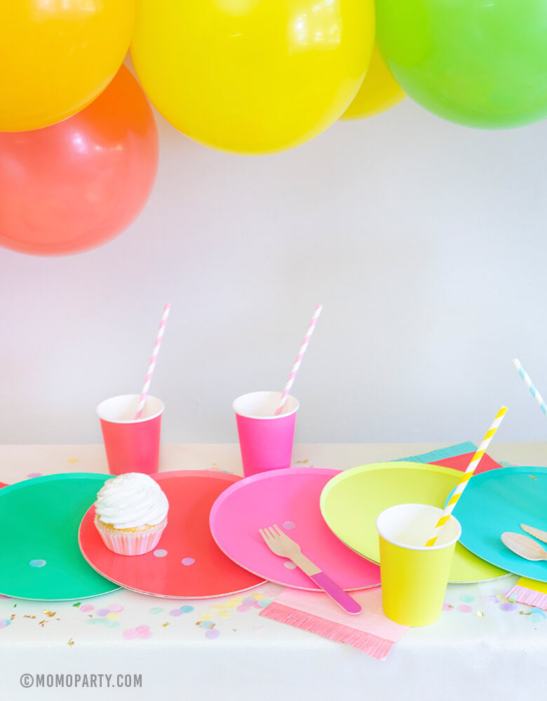 Rainbow Party Dessert table with Oh happy day colorful Rainbow Large Plate Set, Rainbow Cup Set, cupcakes, Hyper Tropical Wooden Cutlery Set, Hip Hip Hooray Fringe Small Napkins for a modern rainbow themed birthday party, pride party, unicorn party