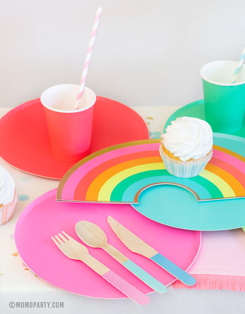 Modern Rainbow Party Dessert table with Oh happy day Rainbow Plates, colorful Rainbow Large Plate Set, Rainbow Cup Set, cupcakes, Hyper Tropical Wooden Cutlery Set, Hip Hip Hooray Fringe Small Napkins for rainbow themed birthday party, pride party, unicorn party