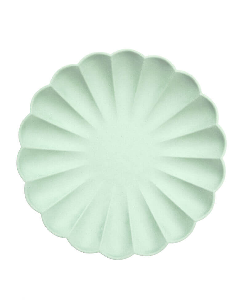 Multi color Simply Eco Large Plates - Mint color by Meri Meri . Pack of 8, made from natural materials. Crafted from pulp made from bamboo, wood fiber and sugarcane which is then dyed using water-based inks. They have a beautiful molded design with a stylish scalloped edge.