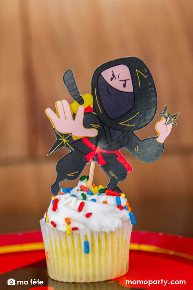 Momo Party's Ninja Cupcake Kit by Ma Fête. Featuring Ninjas cupcake toppers on the cupcake, The toppers include gold foil details to give cupcakes an eye-catching finish. They are perfect for a Ninja themed birthday party