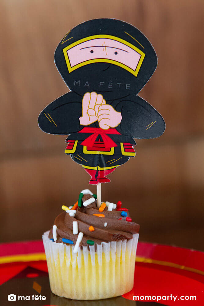 Momo Party's Ninja Cupcake Kit by Ma Fête. Featuring Ninja cupcake topper on the cupcake, The toppers include gold foil details to give cupcakes an eye-catching finish. They are perfect for a Ninja themed birthday party