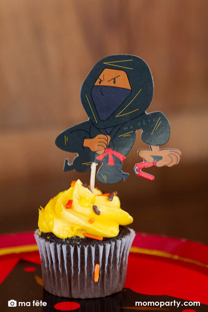 Momo Party's Ninja Cupcake Kit by Ma Fête. Featuring Ninja cupcake topper on the cupcake, The toppers include gold foil details to give cupcakes an eye-catching finish. They are perfect for a Ninja themed birthday party