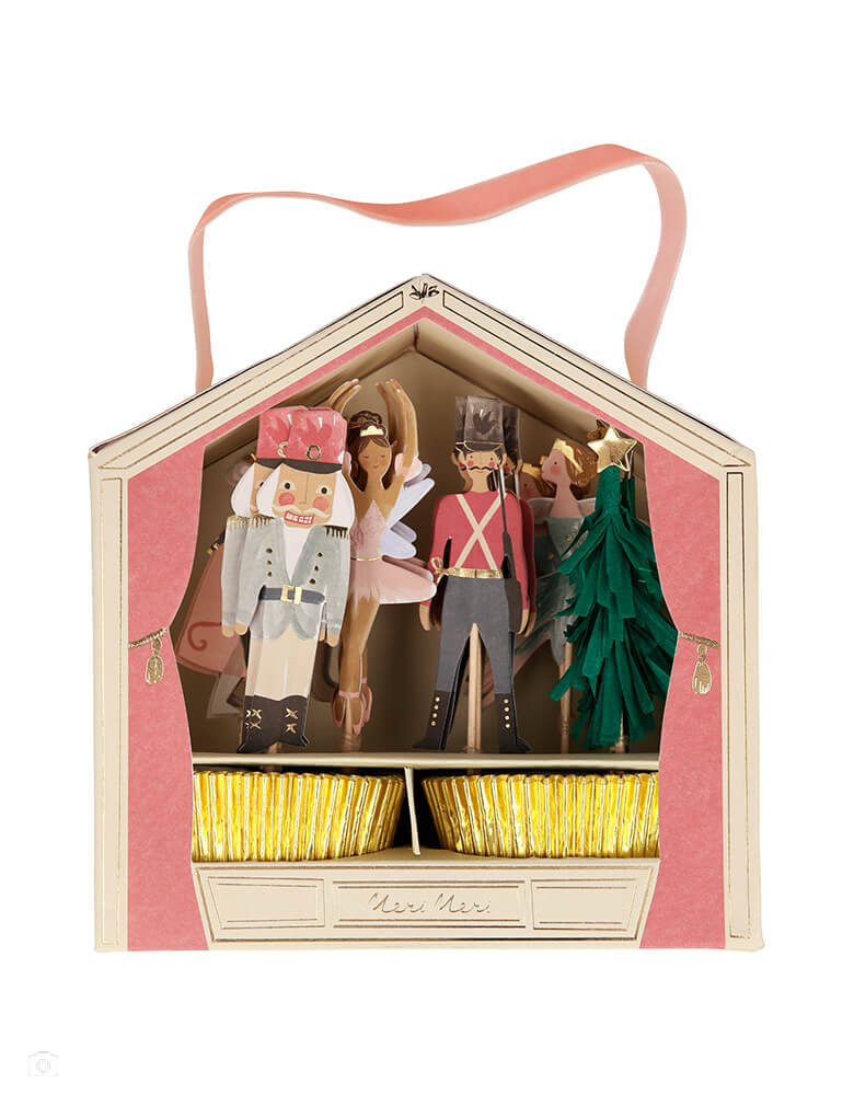Meri Meri  -Nutcracker Cupcake Kit. Featuring Nutcracker themed topper designs include Nutcracker characters and a green fringed crepe paper Christmas tree, with gold foil star on top. It also includes 24 gold foil cupcake cases for a really stylish effect. The kit is beautifully presented in a box with a pink velvet ribbon handle, so makes a fabulous gift too! It make your cupcakes look super special this Christmas with this Nutcracker kit. 