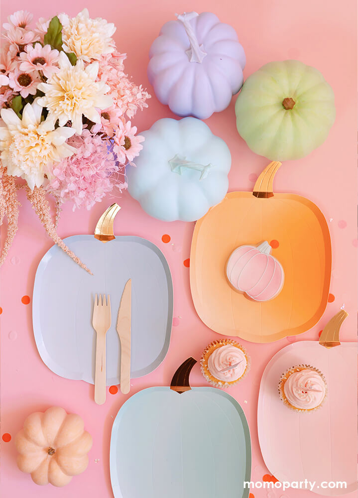 Meri Meri - Ombre Halloween Pumpkin Plates in 4 ombre shades, of orange, pink, mint and blue, and crafted from bright thick paper with shiny gold foil stalks with pumpkin cookie, cupcakes on them. Pastel pumpkin decoration, dry flowers, confetti around on the pink background.  These ombre pumpkin plates look terrific for your fall themed celebration or Halloween party, they'll look magnificent served with snacks and treats.
