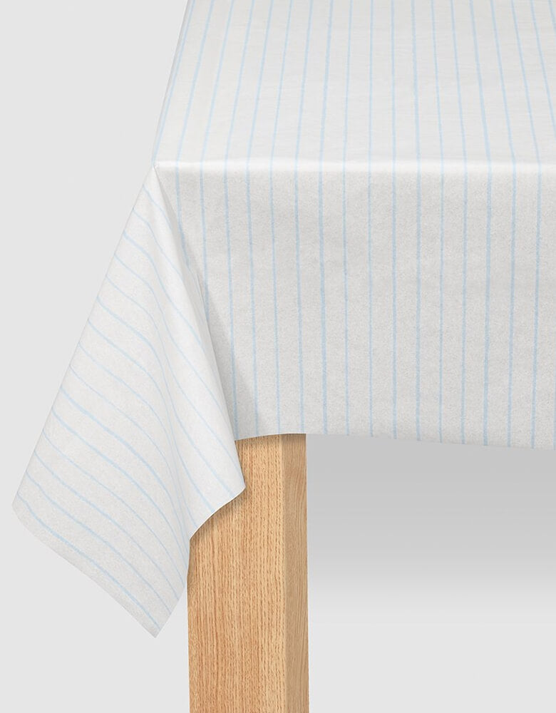 Coterie - Pale Blue Pinstripe Tablecloth. 8.5ft x 4.5ft. Made from a super soft paper that Recyclable and compostable, this modern Pale blue pinstripe tablecloth does double duty: protecting surfaces and adding a great design touch to your tablescape.