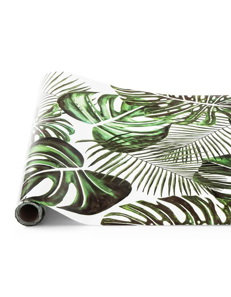Momo Party's 25 x 20" Monstera Leaf Paper Table Runner by Weddingstar Inc. Printed with a fun, green tropical leaf pattern over a bright white backdrop, the paper table runner is the perfect accent for your party tables. You can pair it with a solid colored tablecloth or overlay the "Monstera Leaf" table runner on a bare table surface for a modern decorative aesthetic. The ideal backdrop for your centerpiece arrangements, the runner comes in a roll that holds 25 feet of the cute patterned paper.