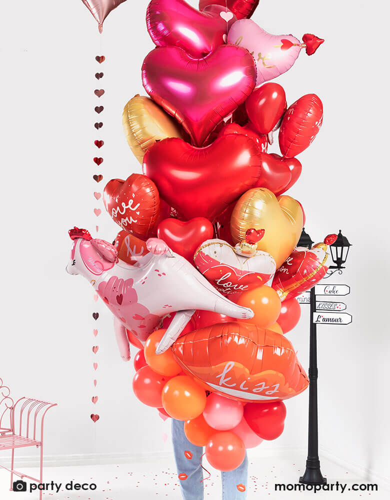 A bouquet of Momo Party's red and pink heart-shaped balloons in different sizes and designs by Party Deco, a fun way to celebrate Valentine's Day.