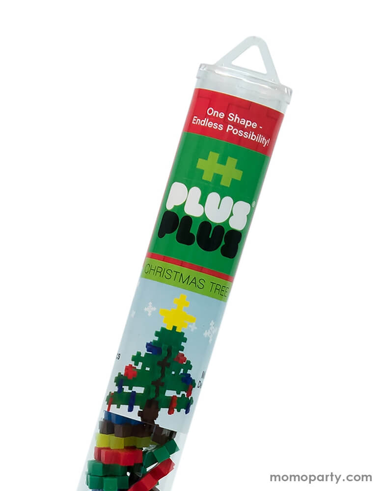 close up package of Plus-Plus Christmas Tree Tube. The 70 piece Christmas Tree tube with classic tree colors pieces - green brown, neon yellow, red and blue colors, it makes a great stocking stuffer this Holiday season, A perfect STEM toy to develop fine motor skills, focus and patience - as well as design, imagination and creativity!