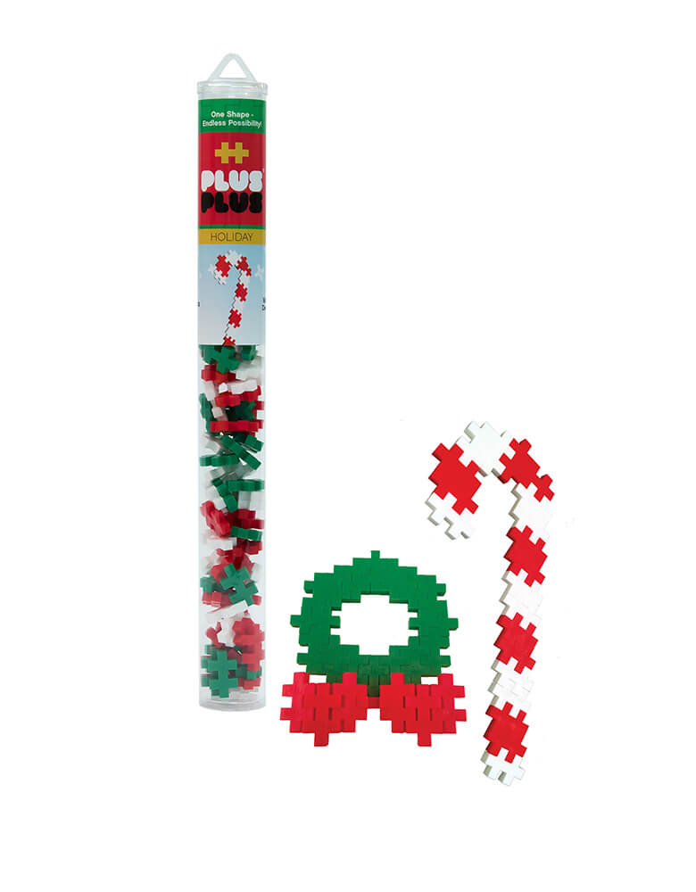 Plus-Plus Holiday Tube. The 70 piece Holiday tube with white green and red colors,  makes a great stocking stuffer this Holiday season, A perfect STEM toy to develop fine motor skills, focus and patience - as well as design, imagination and creativity!