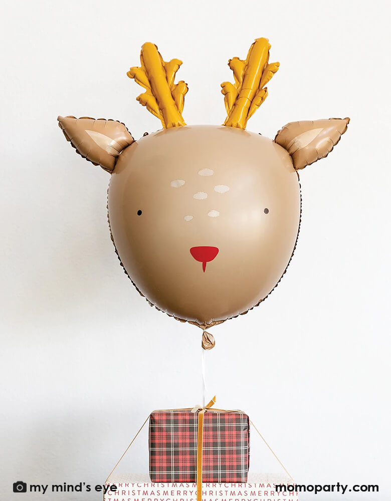 Adorable Rudolph the red nosed reindeer balloon by My Minds Eye for a delightful christmas celebration. Party decor that will be loved by kids and adults, this reindeer balloon will set a joyful and merry mood as you wait for Santa Claus and reindeers. Decorate your home easily with this lovable reindeer balloon 26 inch in size. The red and gold colors work beautifully with other Christmas ornaments, forest winter and gingham decor at momoparty.com. Great fun for kids when set next to Christmas gifts.