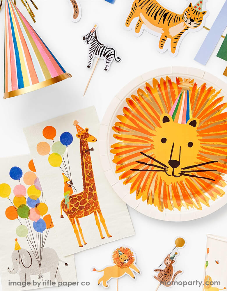Party Animal birthday table top filled with Rifle Paper Co Party Animals Large Plates with Lion head design, Party Animals Guest Napkins, Party Animals Cups, Party Animals Cupcake Kit, Feliz Party hats from Rifle-Paper-Co New Party Animals collection. These modern designed partyware will bring an extra dose of fun to your party table, 1st birthday party, party animal themed party, zoo themed party, get wild party, safari animal themed party, kids birthday, or any animal lovers party