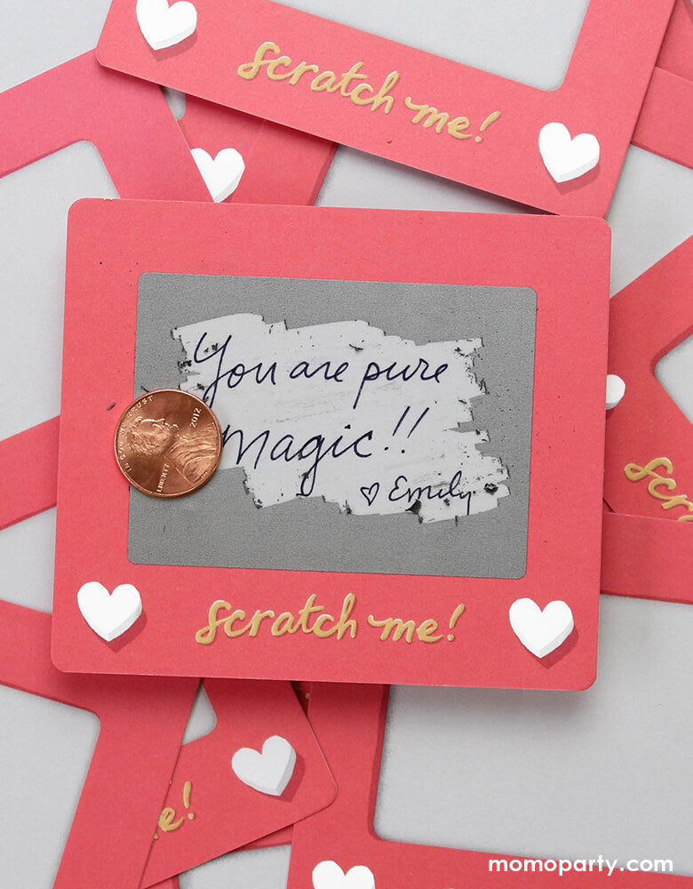 Inklings Paperie® Scratch A Sketch Valentines card scratched by a quarter, revealing the message of "you are pure magic! love emily" . Hide your message in a scratch-off with this set of 6 scratch-off notes by Inklings Paperie! Using any pen or pencil, write your message in the designated area, cover it with a silver scratch-off sticker provided, and scratch to reveal your hidden message! These tiny notes are the perfect size to slip into a lunch box or pocket of someone special.