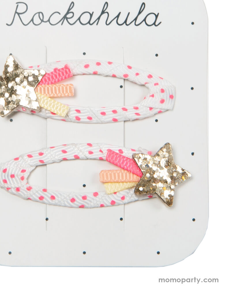 Close up details of Rockahula Kids - Shooting Star Clips. Set of 2. Catch a falling star and wear it in your hair with our beautiful clips - two gold glittery stars each with bright coloured ribbon tails, secured to a gorgeous white and pink spotty ribbon wrapped snap clip.